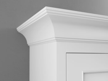 A close up corner of Beaded Cove Molding at the top of a kitchen cabinet from Dura Supreme Cabinetry.